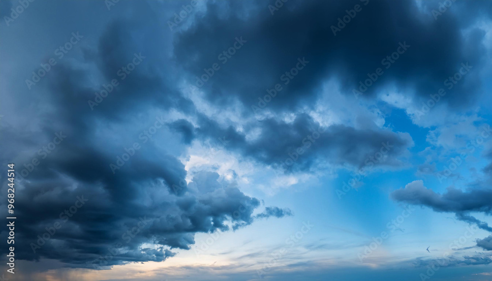 Dramatic sky at evening panoramic shot. Scenic blue gray clouds before the storm. Overcast cloudscape before the rain. Blue hour stormy cloudscape. Dark thunderstorm sky wide image. Sky only. Dramatic sky at evening panoramic shot. Scenic blue gray clouds before the storm. Overcast cloudscape before the rain. Blue hour stormy cloudscape. Dark thunderstorm sky wide image. Sky only.
