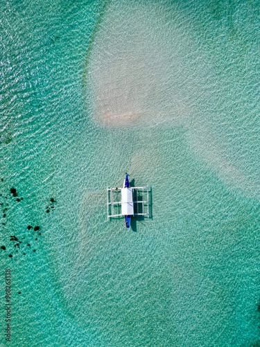 Drone view of a boat on a sandbar in Balabac, Philipinnes