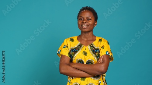 Canvastavla Natural optimistic girl nodding her head and saying yes in studio, smiling and showing positive emotions against blue background