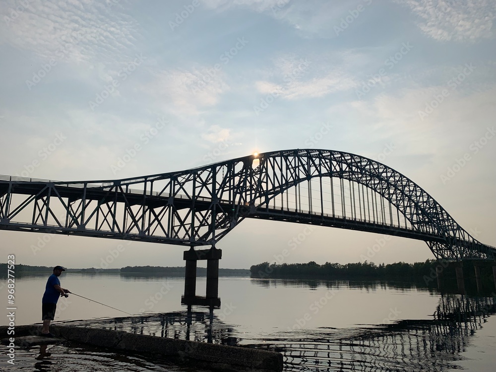 bridge over river and fisherman bridge over river and fisherman