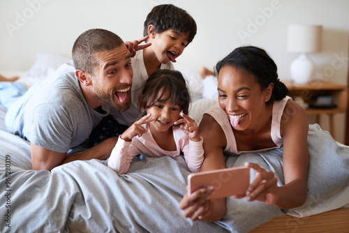 Canvas-taulu Family, selfie and phone in bedroom for playful, relax and live streaming together with video or app