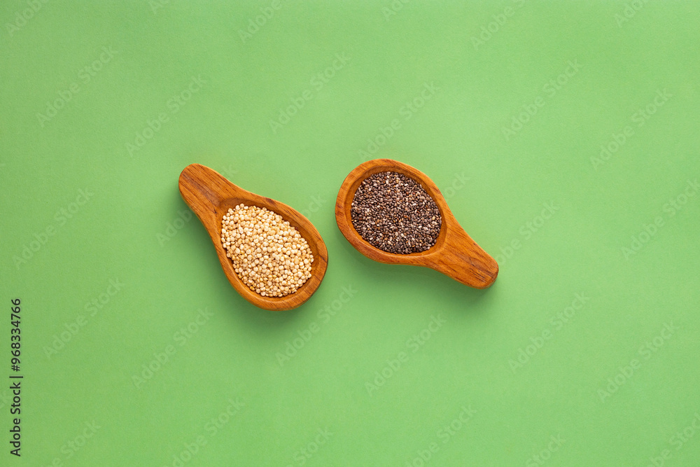 Flax and chia seeds in two spoons - Salvia hispanica and Chenopodium quinoa. Flax and chia seeds in two spoons - Salvia hispanica and Chenopodium quinoa.