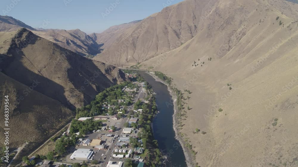 Riggins Idaho high aerial above town on hazy summer day Riggins Idaho high aerial above town on hazy summer day