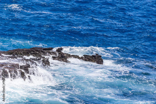 Dramatic Ocean crashing wave Hawaii at Makapu Point