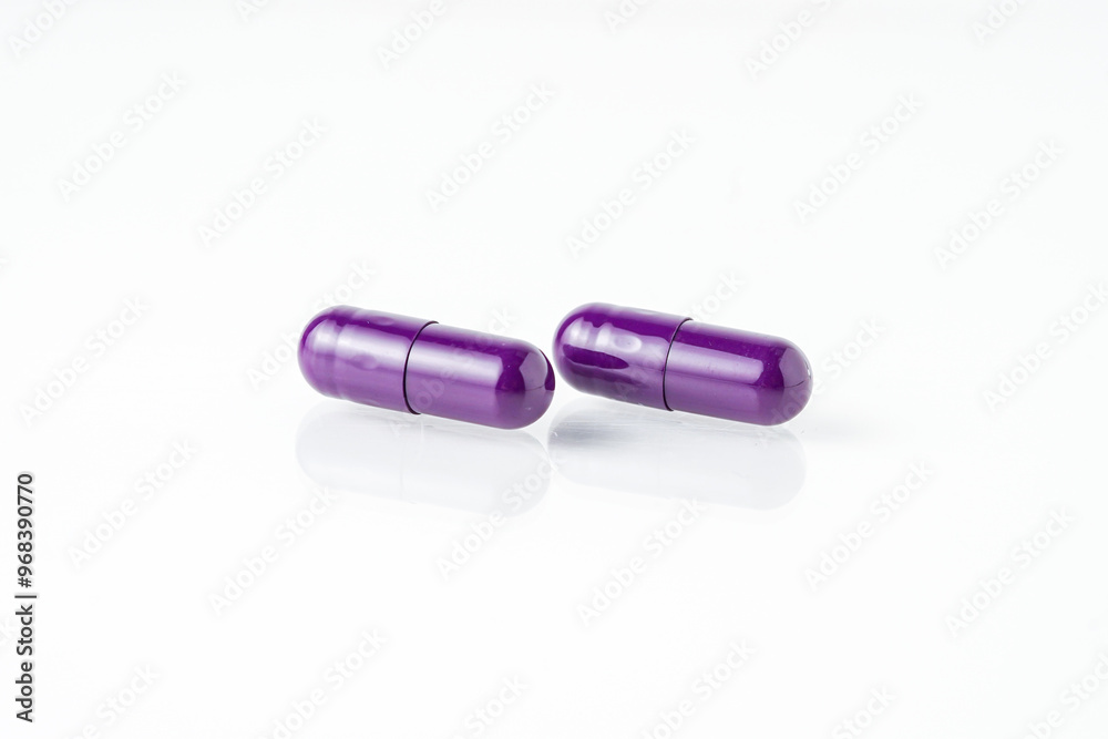 Two medicine capsule pills, supplement isolated on with background Two medicine capsule pills, supplement isolated on with background