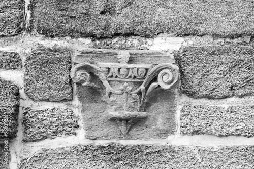 Black and white photo of a decoration in a coquina wall in St. Augustine. 