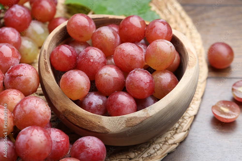 Fresh ripe grapes on wooden table, closeup Fresh ripe grapes on wooden table, closeup