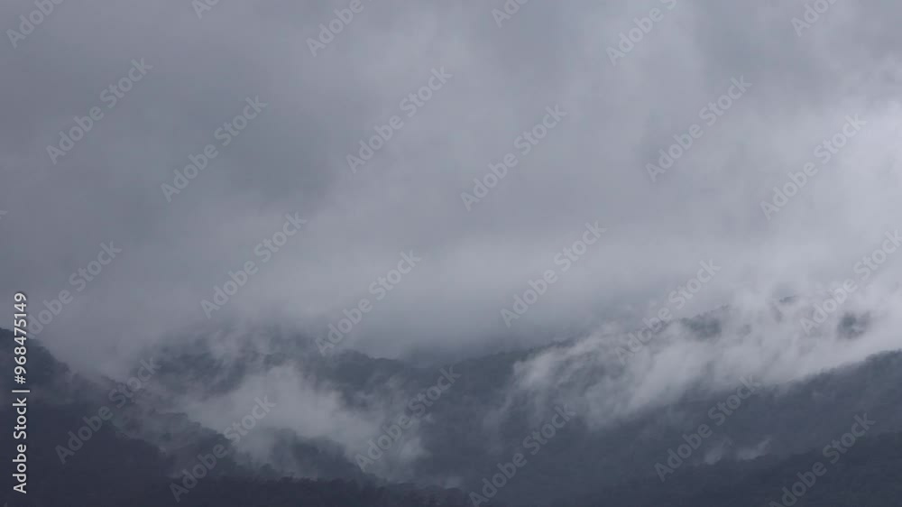Misty mountain top. Cloudy and misty mountain top with slow moving, atmospheric clouds. Misty mountain top. Cloudy and misty mountain top with slow moving, atmospheric clouds.