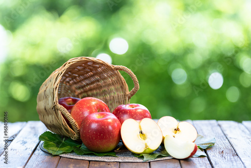 Red Japanese Apple on bamboo basket Shinano Red and Sansa  Apple on wooden background.  photo