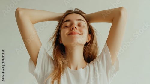 Casual woman midyawn, stretching arms upward, eyes halfclosed, white background, morning routine vibes, dynamic pose, energetic wakeup scene photo