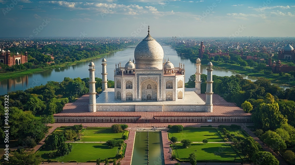 Fototapeta premium 6. Aerial shot of the Taj Mahal in India, nestled within lush gardens and reflecting pools, framed by the Yamuna River and the bustling city beyond