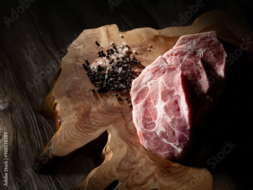 Pork Neck on old wooden board photo