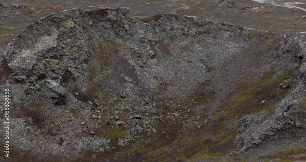 Behold the majestic sight of an undiscovered volcano near Myvatn at Reykjahlid in Iceland! The landscape of black and gray mountains is absolutely awe-inspiring in this stunning shot. Behold the majestic sight of an undiscovered volcano near Myvatn at Reykjahlid in Iceland! The landscape of black and gray mountains is absolutely awe-inspiring in this stunning shot.