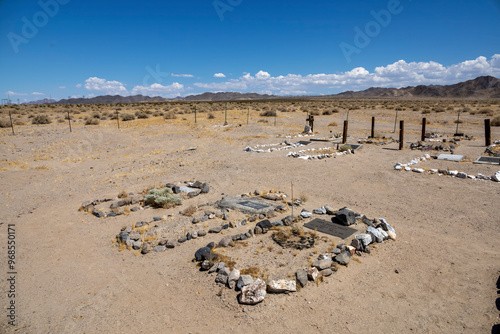 Vászonkép Silver Lake Cemetery, located between Death Valley and Mojave National Preserve in California, features graves set against an arid desert backdrop, offering a glimpse into the area's remote history