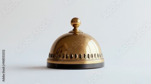 Brass service bell on a clean white background highlighting traditional hospitality tools used in hotels and restaurants