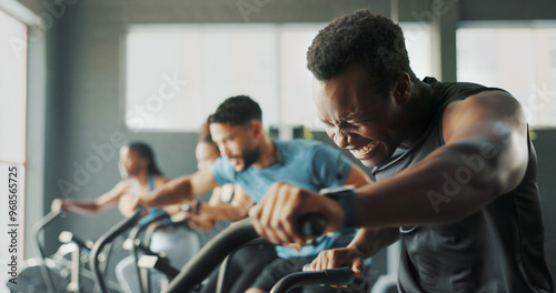 Exercise bike, fitness and training with people in gym together for cardio or intense workout. Active, elliptical machine and power with athlete group in health club for challenge or performance