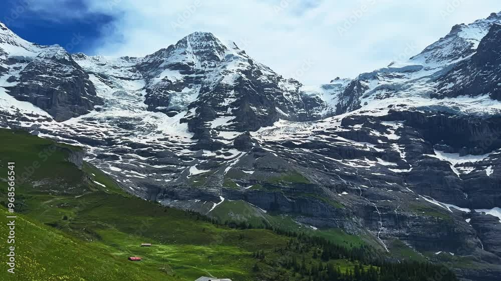 Mountainscape Of Mount Eiger In The Bernese Alps, Switzerland. Panning Shot Mountainscape Of Mount Eiger In The Bernese Alps, Switzerland. Panning Shot