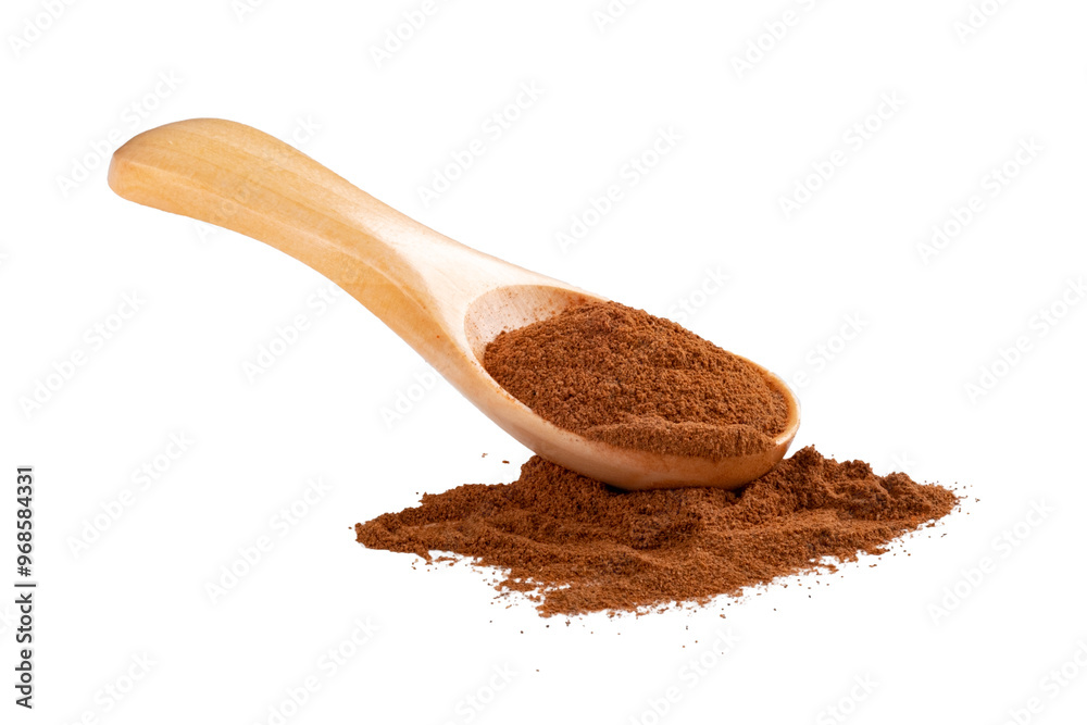 Ground cinnamon in a spoon isolated on a white background. Powdered cinnamon sticks for cooking Ground cinnamon in a spoon isolated on a white background. Powdered cinnamon sticks for cooking