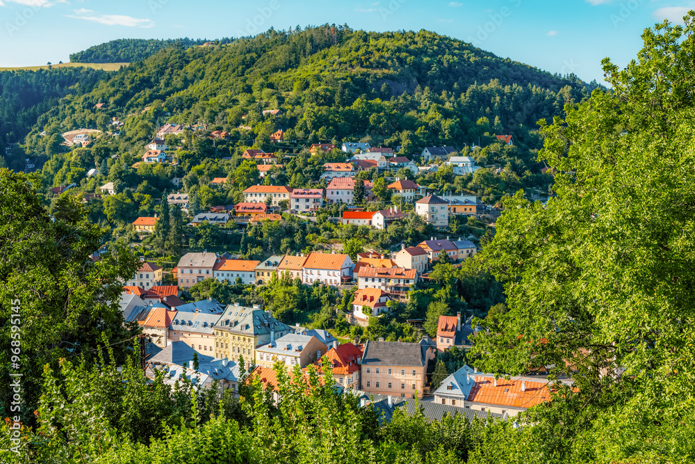Fototapeta premium Romantic scenery of main square in Banska Stiavnica, UNESCO, Slovakia. Old Slovakia mining town with castle in Banska Stiavnica.