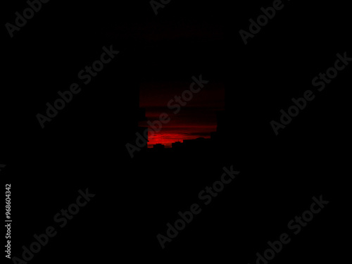 red sky sunset over the dark city
