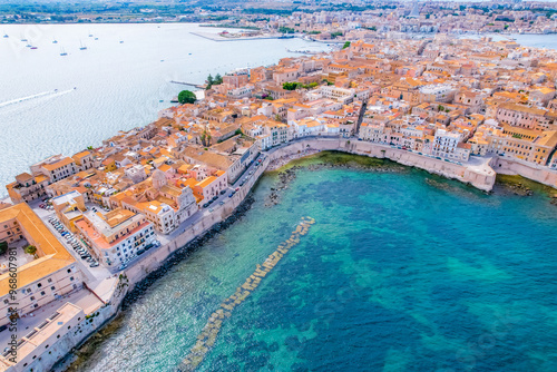 Aerial of Ortigia island, old town with turquoise sea of Syracuse. Small island on Sicily, Italy.