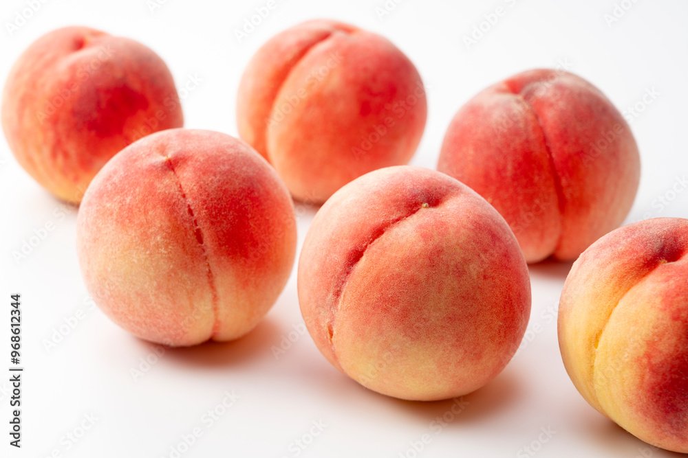 Peaches placed on a white background. Peaches placed on a white background.