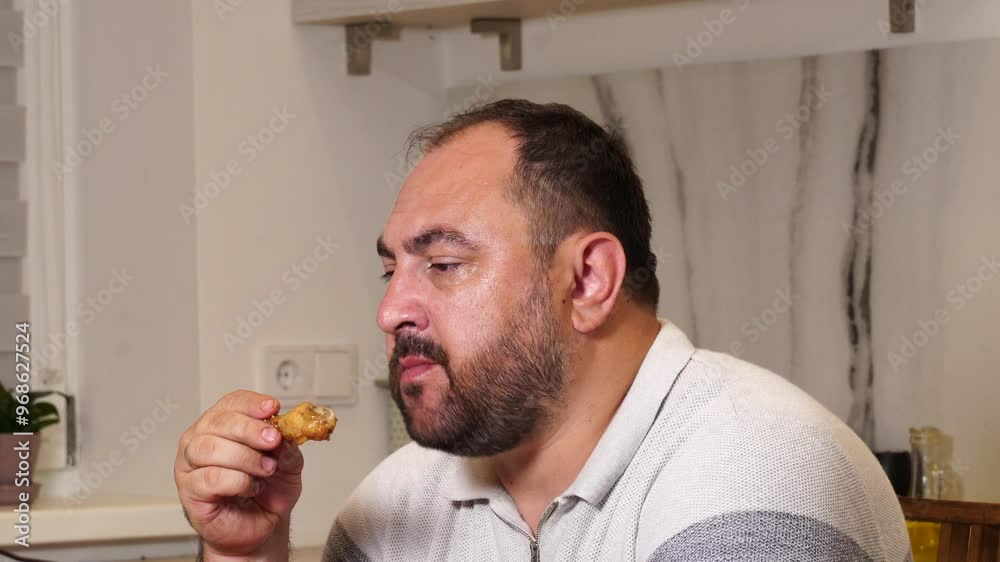 Man eats chichen wings Man eats chichen wings