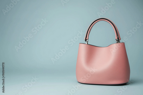 A colour purse is on a blue background. The purse is the main focus of the image.