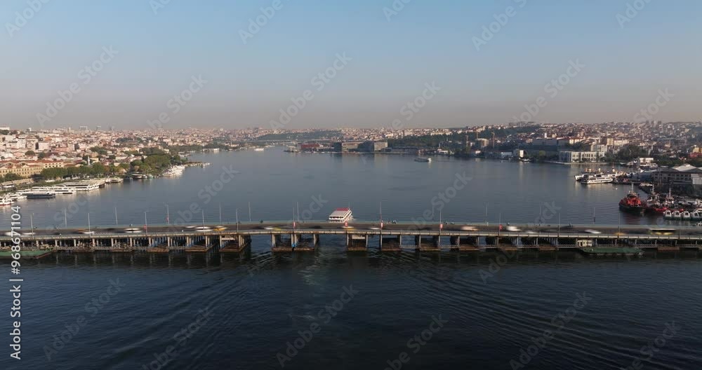 Timelapse of Cars Crossing Ataturk Bridge as Ferry Boat Passes along Golden Horn. Istanbul, Turkey