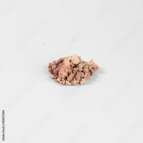 Close-up of loose, raw, ground meat on a light background. Perfect for food industry, culinary, or grocery store stock images. photo