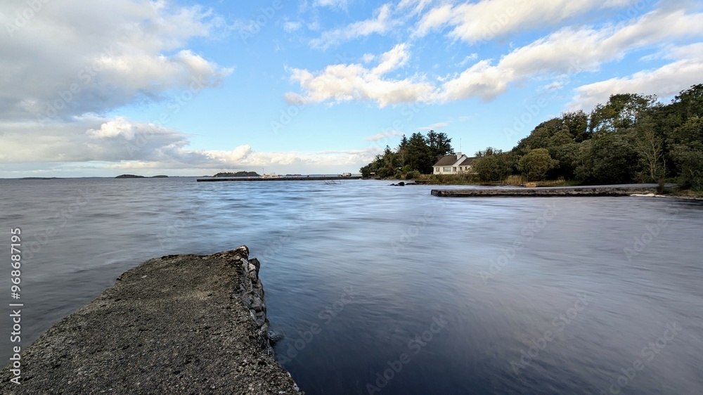 Beautiful lakeside landscape scenery, house by the lake near Oughterard pier on Corrib lake, Galway, Ireland, nature background