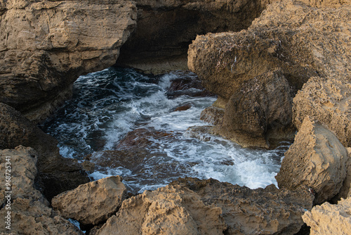 sea ​​water accumulated between rocks. Sea wave between rocks. Carved rocks by the sea. sea water trapped between rocks.
 Cyprus.