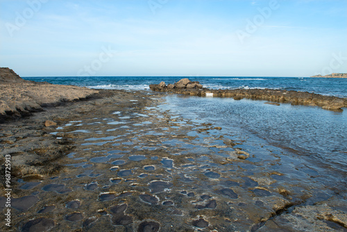 sea ​​water accumulated between rocks. Sea wave between rocks. Carved rocks by the sea. sea water trapped between rocks.
 Cyprus.