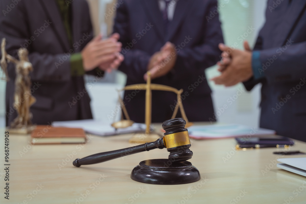 Three lawyers in a meeting at the table in an office, discussing business, civil and commercial law, labor law, marketing and advertising law,offering legal consulting and case management services. Three lawyers in a meeting at the table in an office, discussing business, civil and commercial law, labor law, marketing and advertising law,offering legal consulting and case management services.