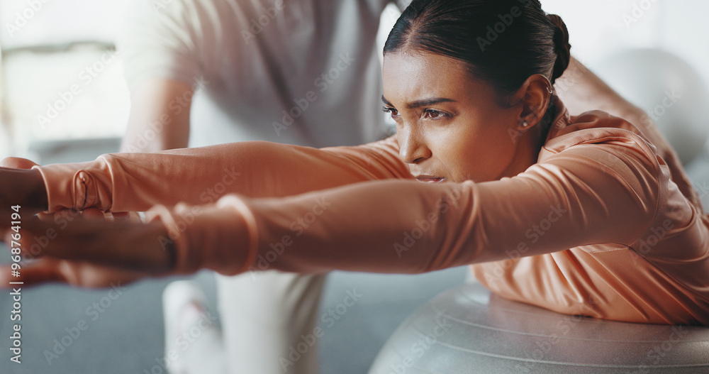 Fototapeta premium Ball, woman and personal trainer in gym for challenge, rehabilitation and balance training. Girl, person and physiotherapy in fitness center for core strength, practice and help in active exercise