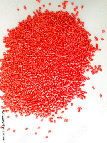 Red masterbatch granule, red polypropylene polymer granules, cold cutting type granule texture, isolated on white background, for industrial plastic company profile product catalog design