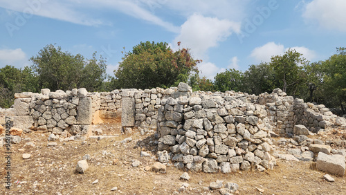 Ruins of an old stone house in the Isikkale ruins, which was founded in the Hellenistic period, located on both sides of the road leading north of Karadedeli village in Silifke district of Mersin photo