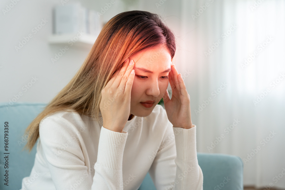 Headache, female having migraine pain, bad health, Asian woman feeling stress and headache, Office syndrome, sad tired touching forehead having migraine or depression, irritated girl, sadness grief Headache, female having migraine pain, bad health, Asian woman feeling stress and headache, Office syndrome, sad tired touching forehead having migraine or depression, irritated girl, sadness grief
