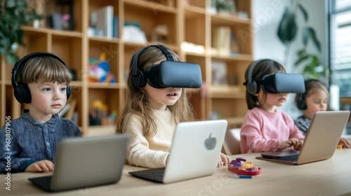 Children engaged in a Montessori-style e-learning experience with laptops and VR headsets, e-leaning concept.