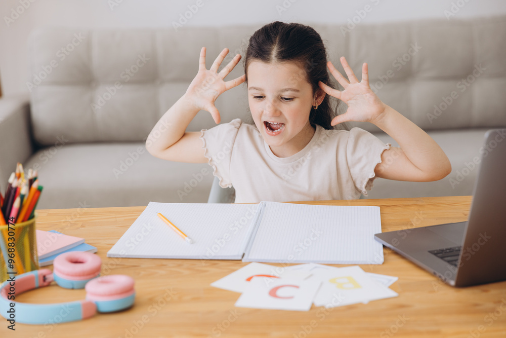 Remote Study Stress. Sad Little Girl Sitting At Desk With Laptop, Upset Female Child Making Facepalm Gesture, Tired Of Distance Remote Study Stress. Sad Little Girl Sitting At Desk With Laptop, Upset Female Child Making Facepalm Gesture, Tired Of Distance