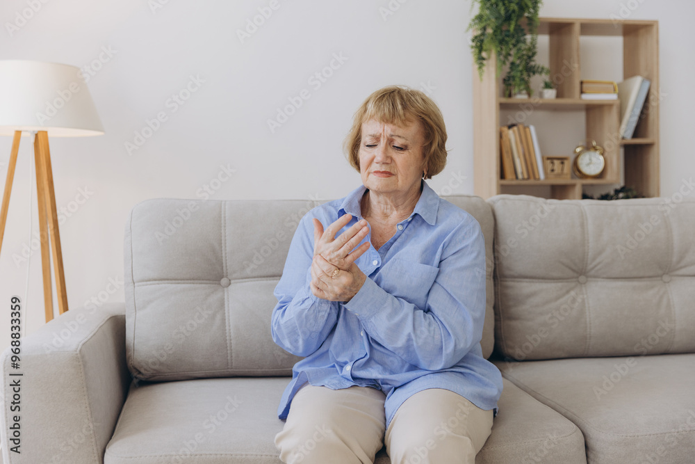 Elderly woman suffering from pain in hand, arthritis old person and senior woman female suffering from pain at home Elderly woman suffering from pain in hand, arthritis old person and senior woman female suffering from pain at home