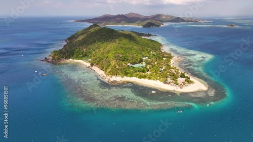 Castaway Island in Fiji. Exotic travel destination of tropical paradise island with coral reef. Aerial drone photo