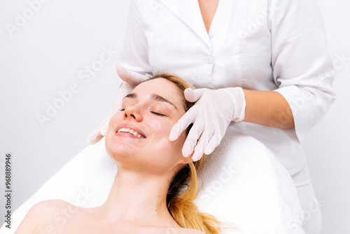 Bilde på lerret Elegant cosmetic clinic: a young woman receives professional care