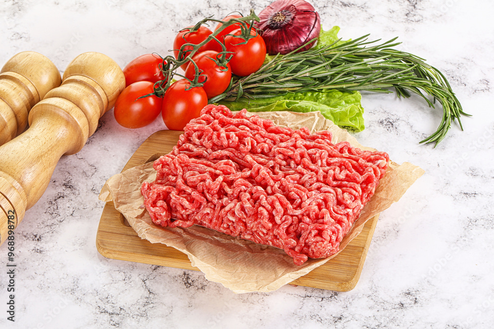 Raw minced beef meat on cutting board Raw minced beef meat on cutting board