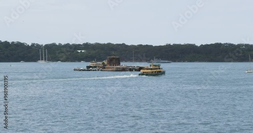 Fort Denison part of the Sydney Harbour National Park, Pinchgut Island, Sydney, Australia.Ferry Boats passing around the Fort Denison. photo