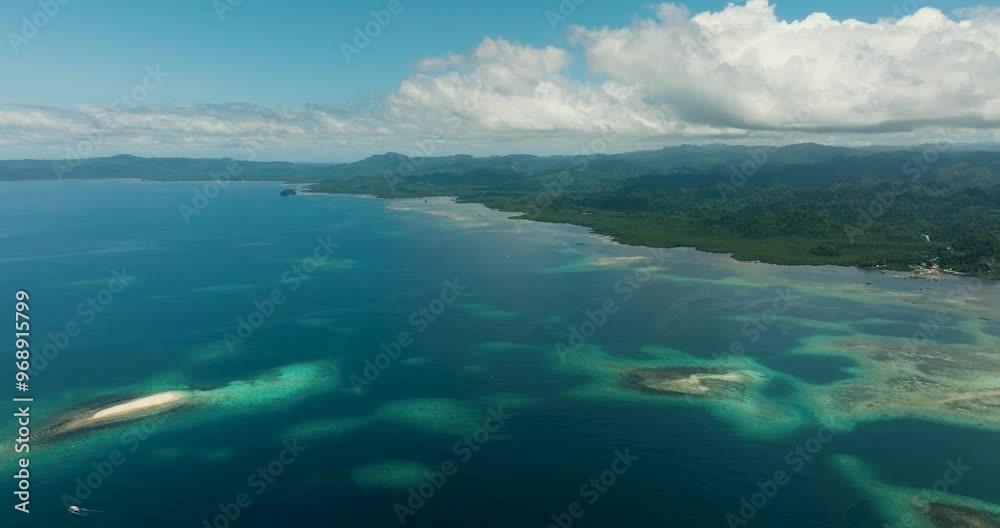 Aerial view of sea surface and turquoise water in Tropical Island. Mindanao, Philippines. Aerial view of sea surface and turquoise water in Tropical Island. Mindanao, Philippines.