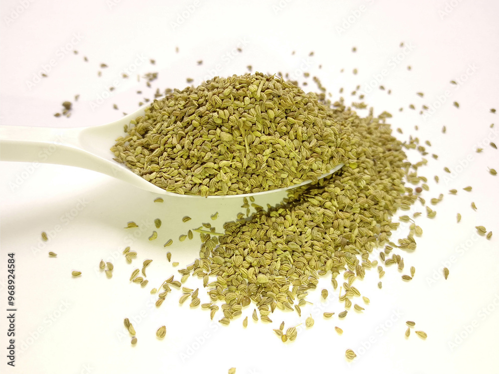 Carom seeds - Sabz Ajwain with spoon isolated on white background Carom seeds - Sabz Ajwain with spoon isolated on white background