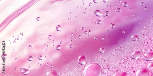 Abstract pink background with water droplets and bubbles.