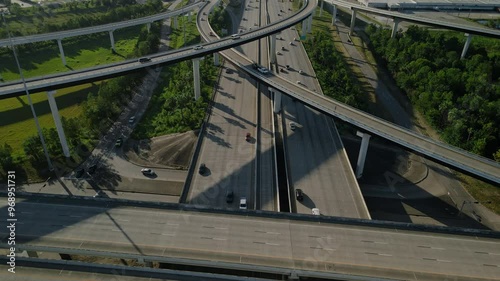 Aerial overview intersection at Interstate freeway 45 and Beltway 8 in Houston, Texas. Network of elevated roads surrounded by green space. Highway junction Sam Houston Tollway and highway I45 photo