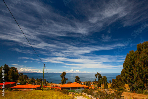 Houses of Local Peruvian People Living on Taquile Island (Isla Taquile) at Lake Titicaca in Puno Peru. photo